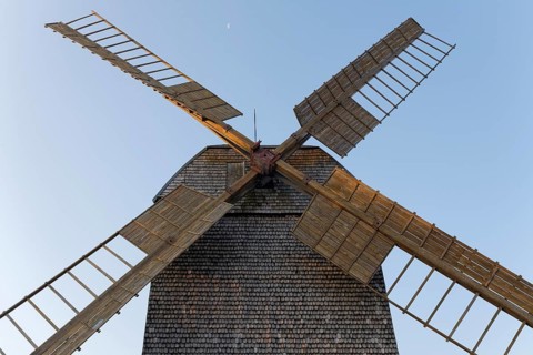 Historic post windmill with wooden shingle cladding