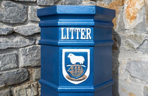 Bin with the coat of arms of the Falkland Islands and the motto 'Desire the Right'