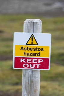 Warning sign 'Asbestos hazard - keep out' at the Stromness whaling station