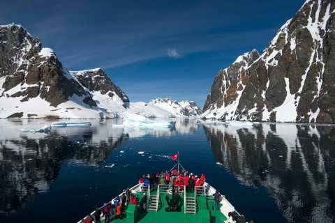 Visitors on the bow of the expedition cruise ship