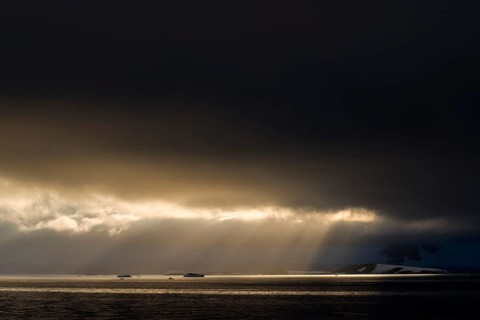 Sunlight shining through a hole in the clouds