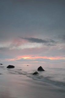 Stones on the beach at sunset