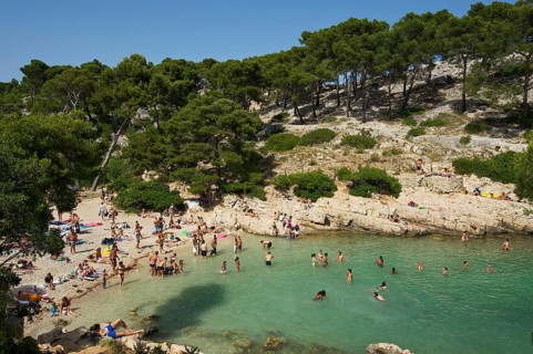 Bathers in the rocky bay Calanque de Port-Pin