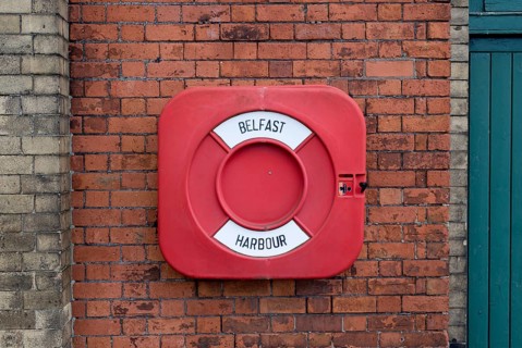 Life buoy on a brick wall