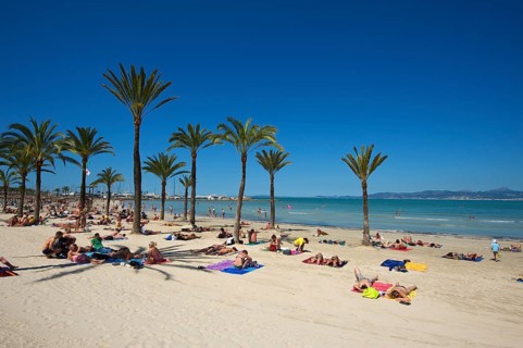 Tourists on Playa de s'Arenal beach