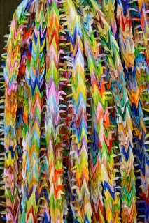Garlands of folded objects on sale as good luck charms