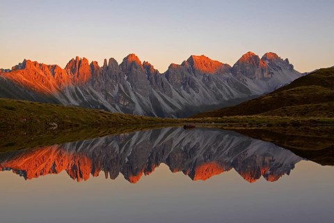 Kalkkoegel mountains reflected in lake