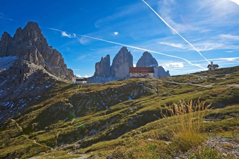Dreizinnenhuette or Three Peaks Alpine hut and chapel in front of the north face of the Three Peaks