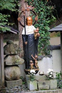 Buddhist Jizo statue with bib and halo