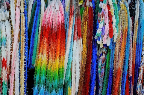 Garlands of folded objects on sale as good luck charms