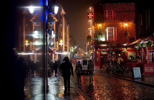 Passers-by in the street outside The Temple Bar