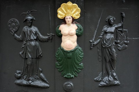 Three relief figures on Roehrenbrunnen fountain of 1727