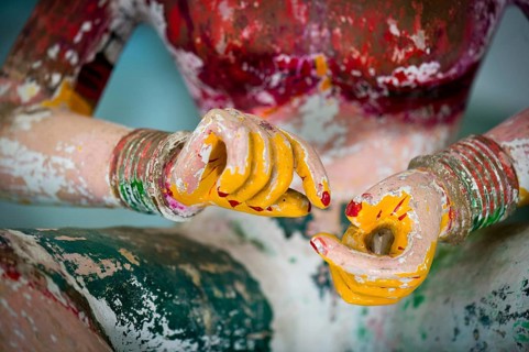 Hands of an old wooden temple figure