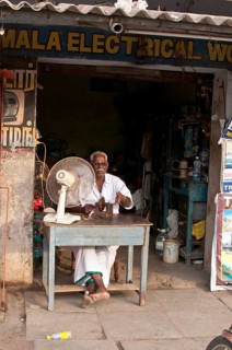 Electrician in front of his business