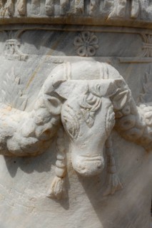 Cow head relief on a pillar