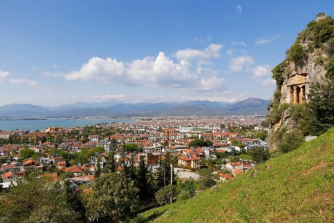 View across the town of Fethiye with Lycian rock tombs