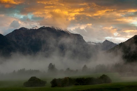 Evening mood with ascending mist in autumn