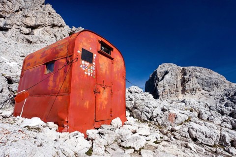 Hut on Bivouac Fiamme Gialle in front of the summit of Cima Vezzena Mountain