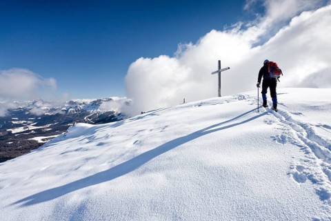 Winter hiker during ascending Schwarzhorn Mountain on Jochgrimm