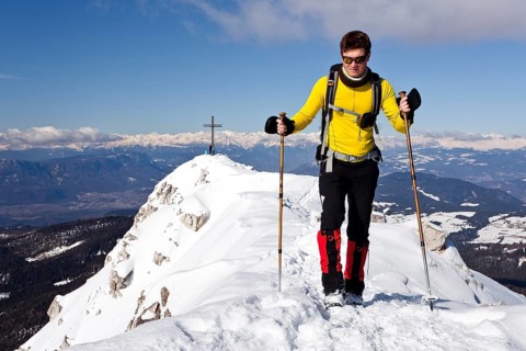 Winter hiker on the summit ridge of Jochgrimm