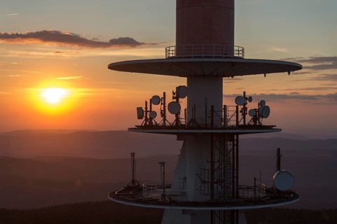 Transmission tower on the summit plateau of Mt Brocken at sunset