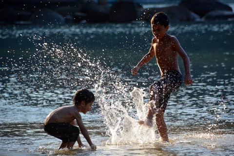 Children playing on the beach of Lopes Mendes