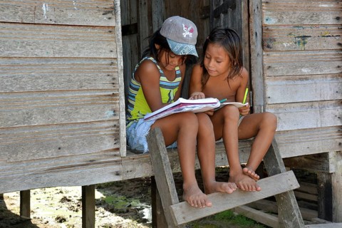Two girls studying in an Indian village