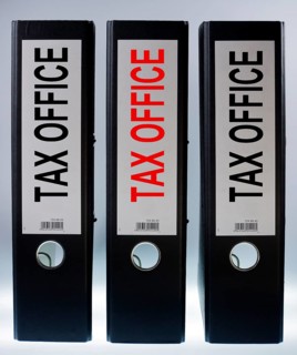 Three file folders labeled 'tax office'