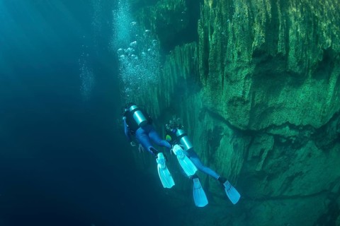 Scuba divers in Barracuda Lake