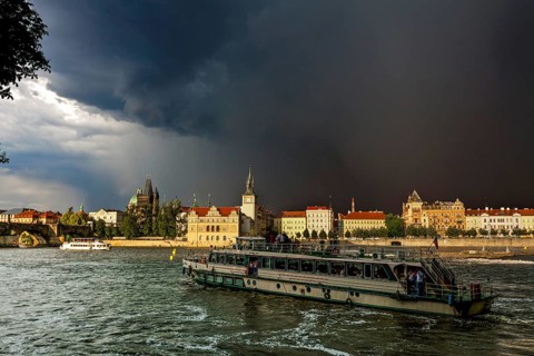 View over the Vltava river towards a thunderstorm