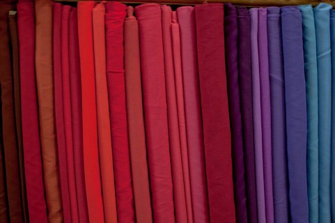 Fabrics lined up on a rack