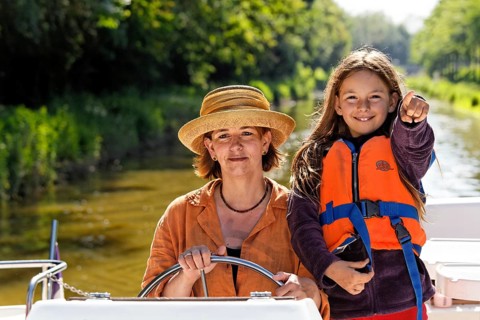 Mother and daughter at the wheel of a Penichette