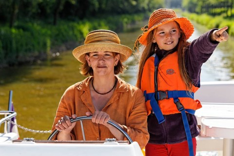 Mother and daughter at the wheel of a Penichette