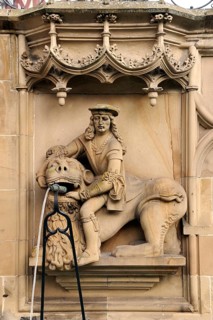 High relief of Samson with the Lion as a well figure on the Gothic Fischbrunnen fountain