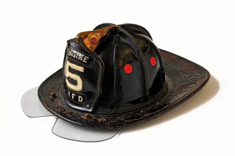 American fireman's helmet made of leather with a hinged eye shield