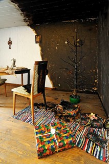 Living room fire caused by burning candles on a Christmas tree