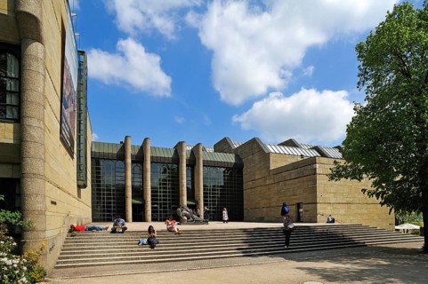 Main entrance of the Neue Pinakothek art gallery with visitors on the stairs