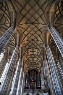 Vaulted ceiling and organ on the gallery of the late-gothic three-naved hall church