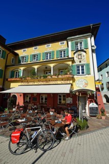 Cyclist having a break outside Cafe Cupido