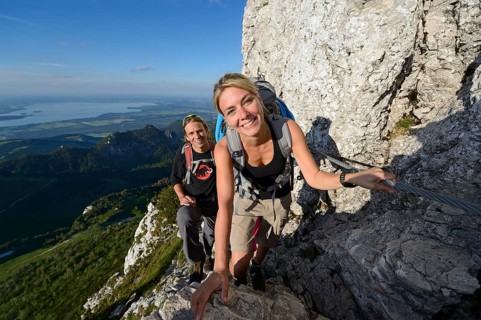 Hikers climbing to the summit of Kampenwand Mountain