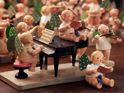 Handmade wooden angels playing musical instruments as a table decoration from the Erzgebirge or Ore Mountains