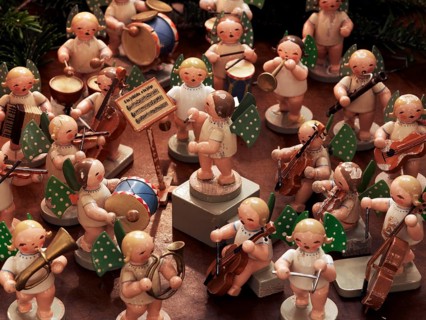 Handmade wooden angels playing musical instruments as a table decoration from the Erzgebirge or Ore Mountains