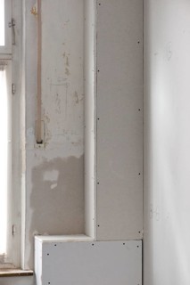 Sewer pipes covered with plasterboard panels