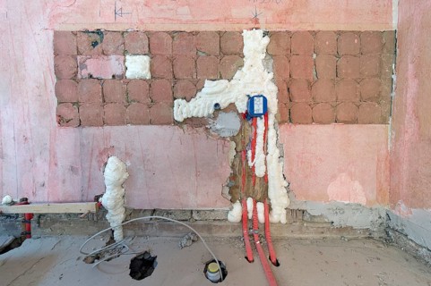 Wall cavities filled with foam insulation