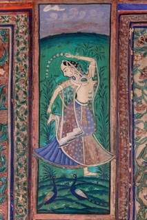 Dancing woman with two peacocks