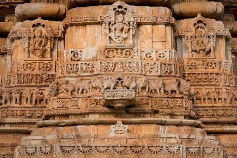 Decorative sculptures on the base of Kirti Stambha
