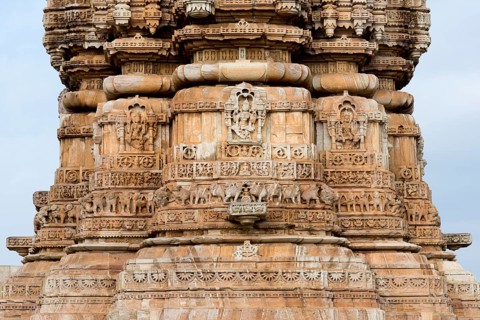 Decorative sculptures on the base of Kirti Stambha