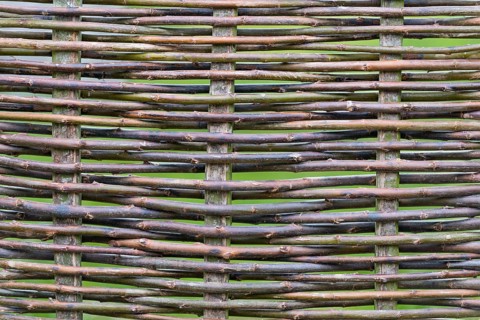 Woven fence made from hazel rods
