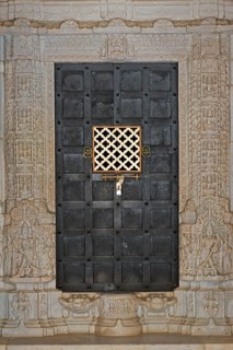 Iron door framed by ornate columns