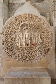Tirthankar Parshvanat in the medallion protected by the thousand-headed serpent God Dharanendra against a powerful storm